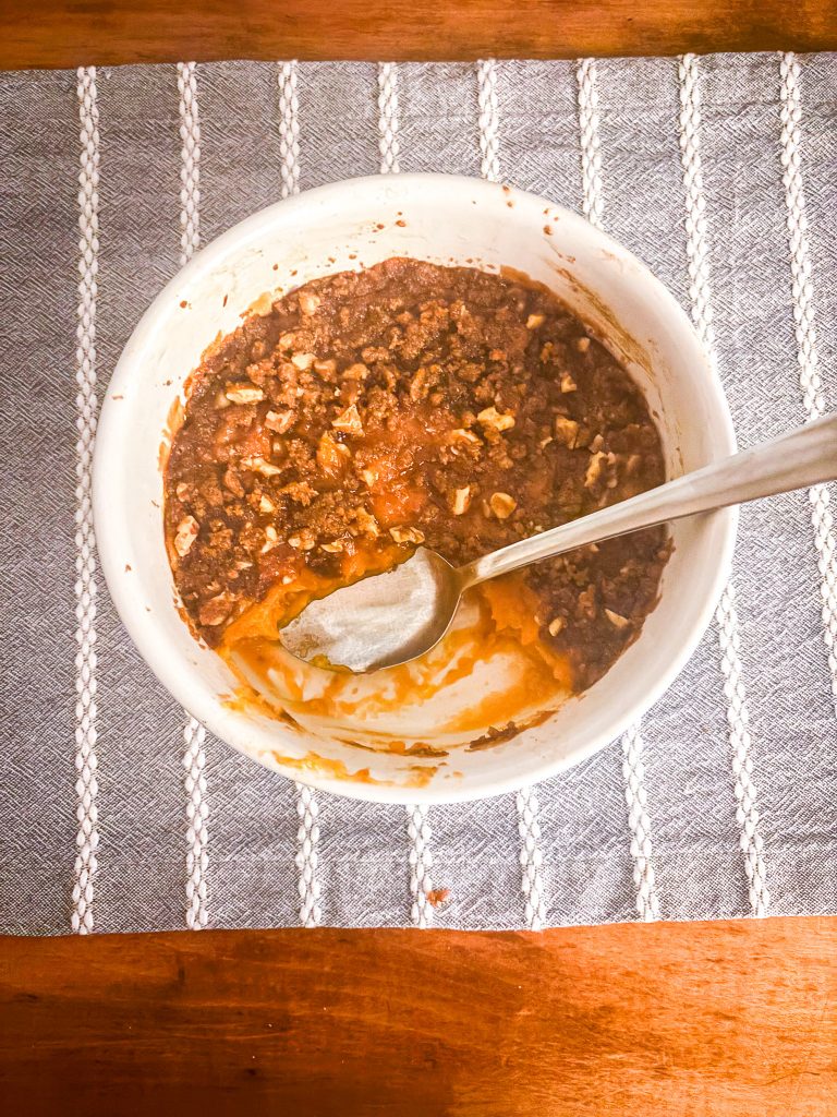 Sweet potato casserole is being served! There is a piece missing from this one.